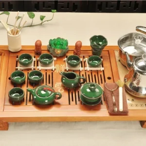 Bộ Bàn Trà Điện Gỗ Tự Nhiên Chạm Khắc Tường Vân Kèm Trọn Bộ Ấm Chén Sứ Men Xanh Ngọc Bích